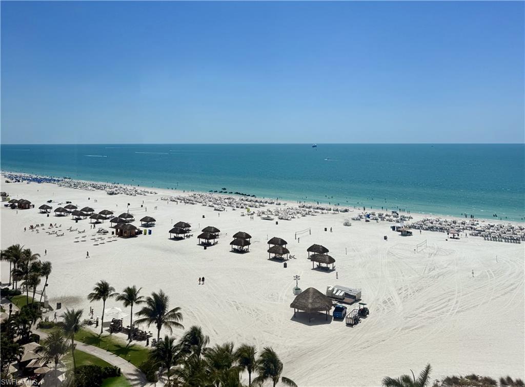 Aerial view of Marco Island's white-sand beach from a high-floor unit, 350 Collier Blvd