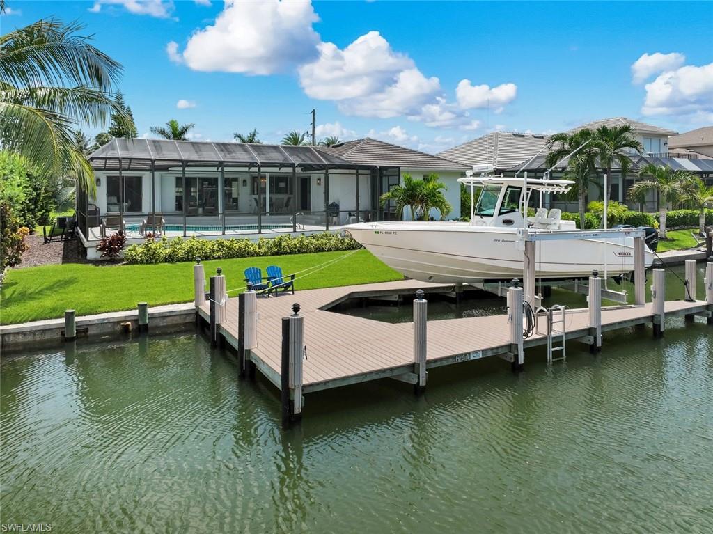 Waterfront canal home with a pool and boat dock, a Gulf Group Marco Island listing